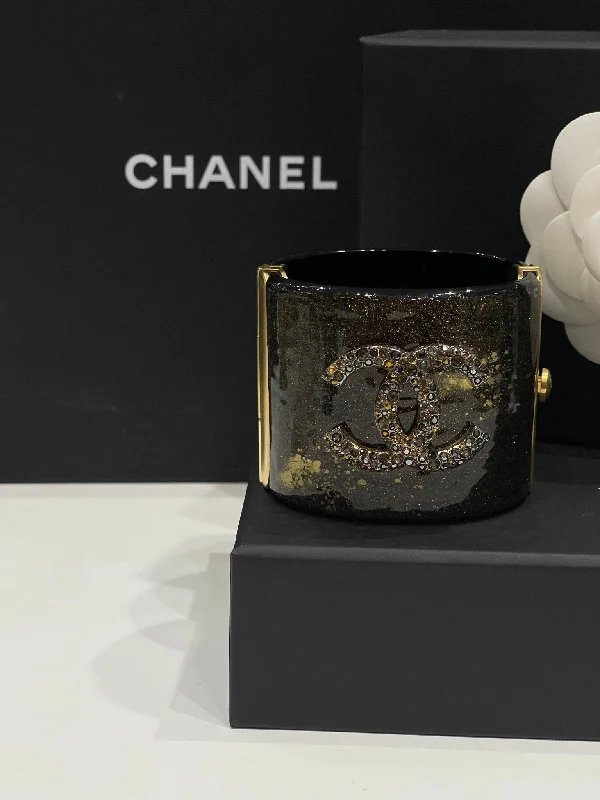 Chanel - Manchette strass bronze